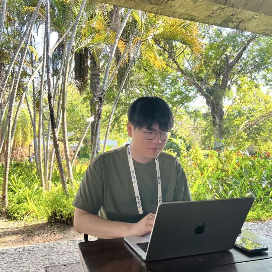 Jitai Hao working on a laptop outdoors